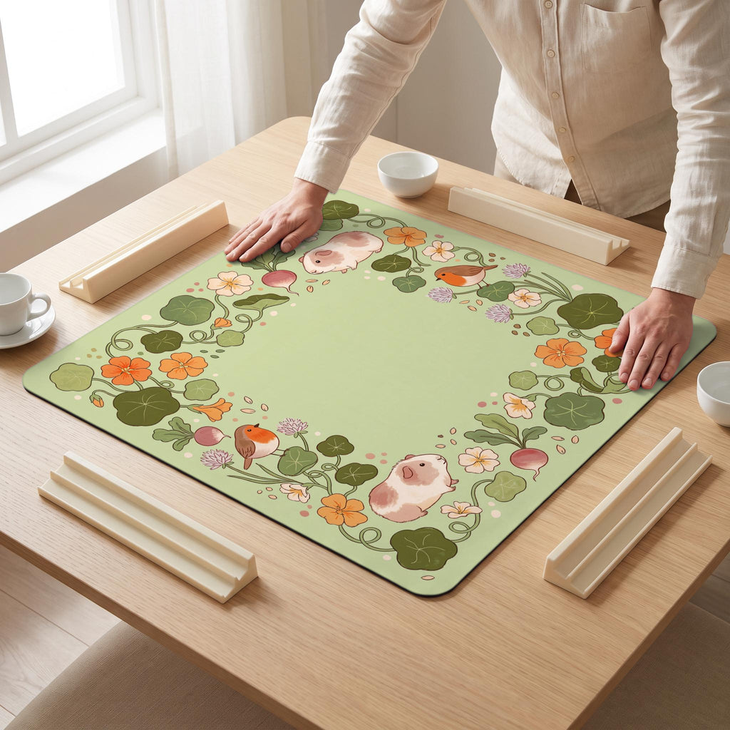 Guinea Pig Garden Mahjong Mat — hands unrolling