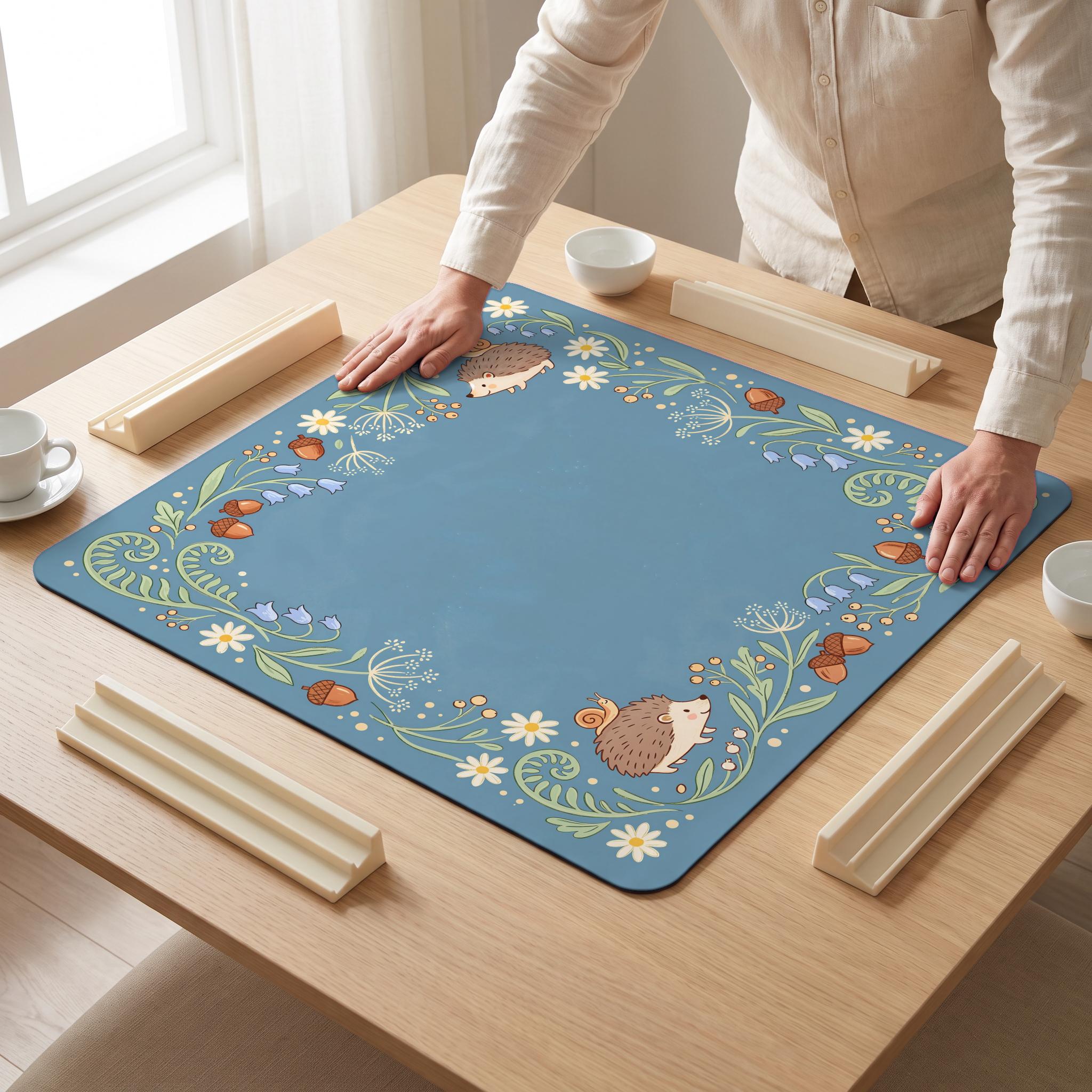 Hedgehog Fern Mahjong Mat — hands unrolling