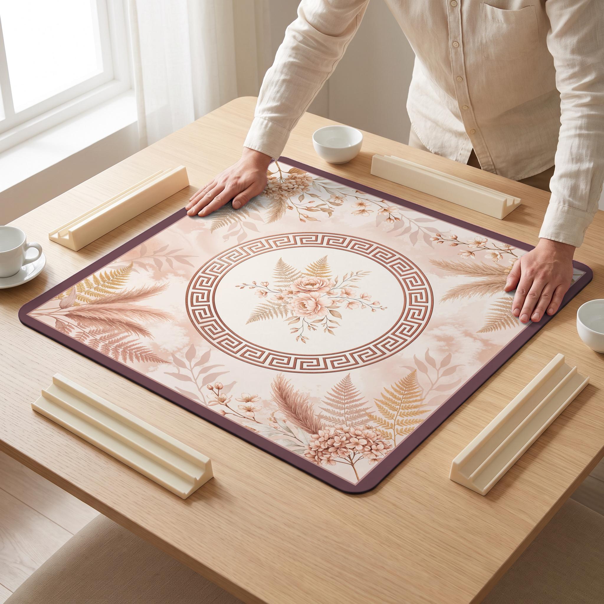 Blush Pampas Mahjong Mat — hands unrolling