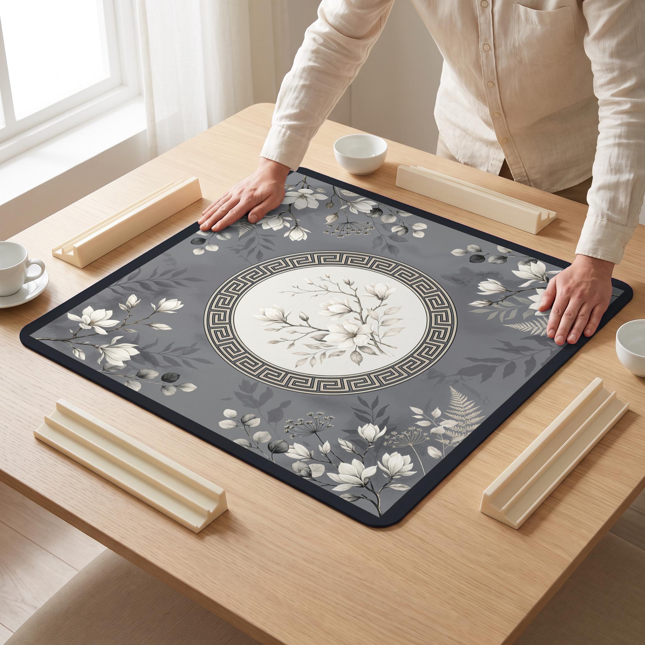 Magnolia Grayscale Mahjong Mat — hands unrolling