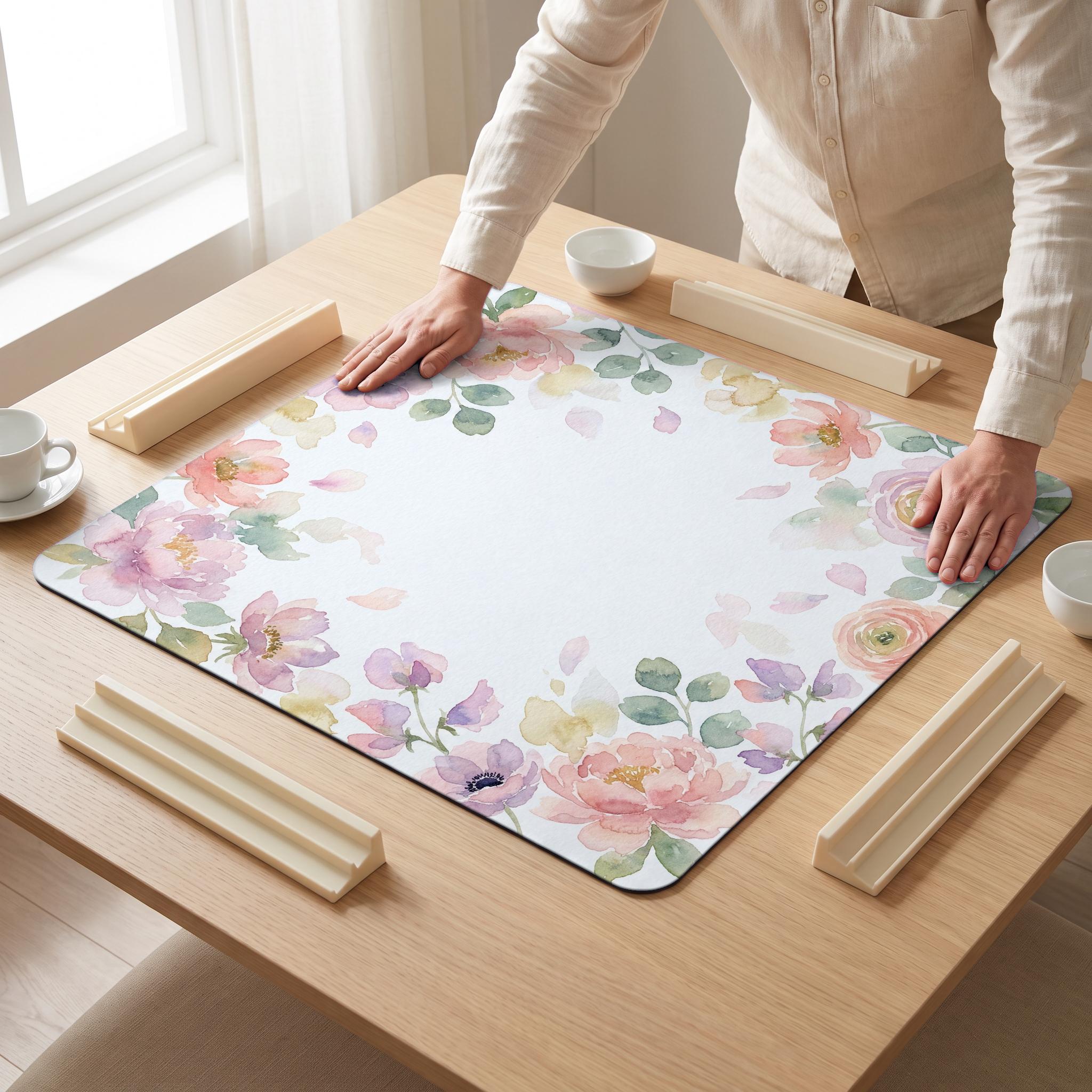Watercolor Blush Mahjong Mat — hands unrolling