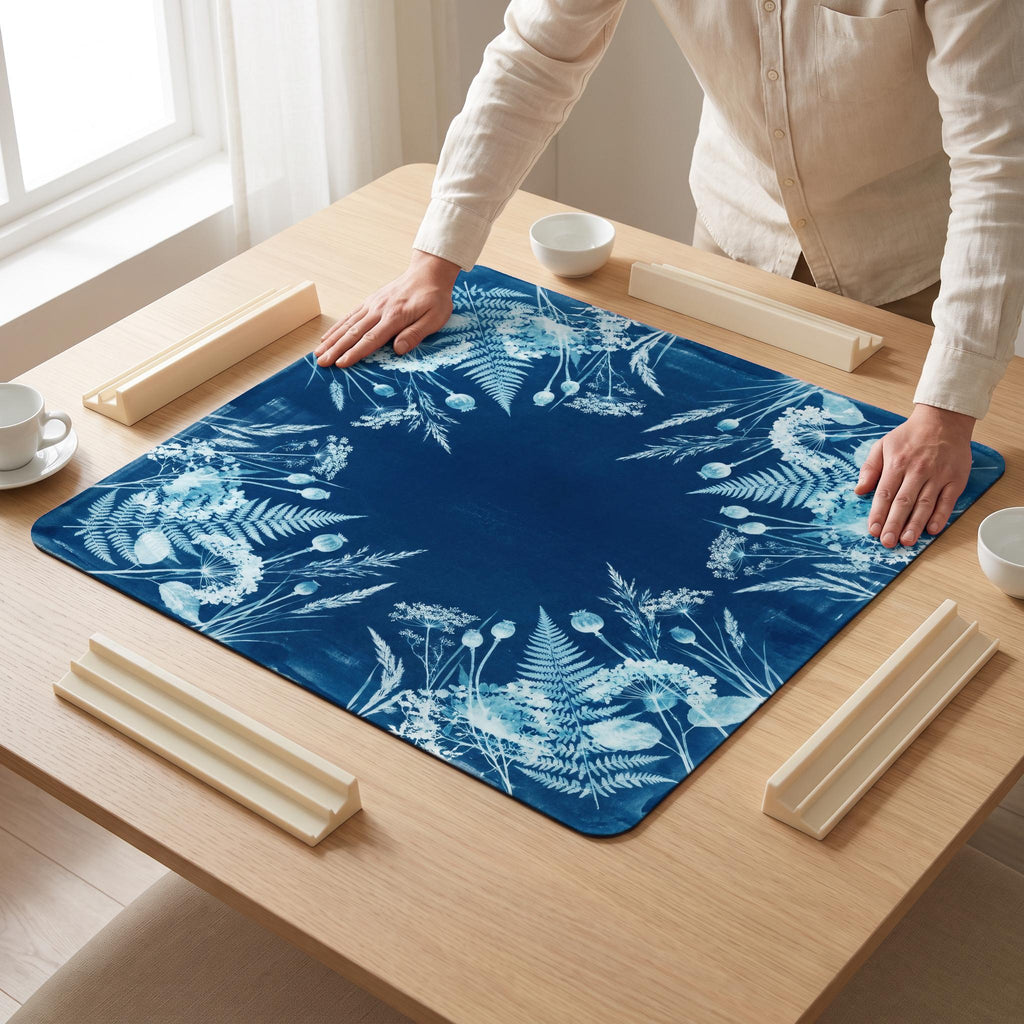 Cyanotype Fern Mahjong Mat — hands unrolling