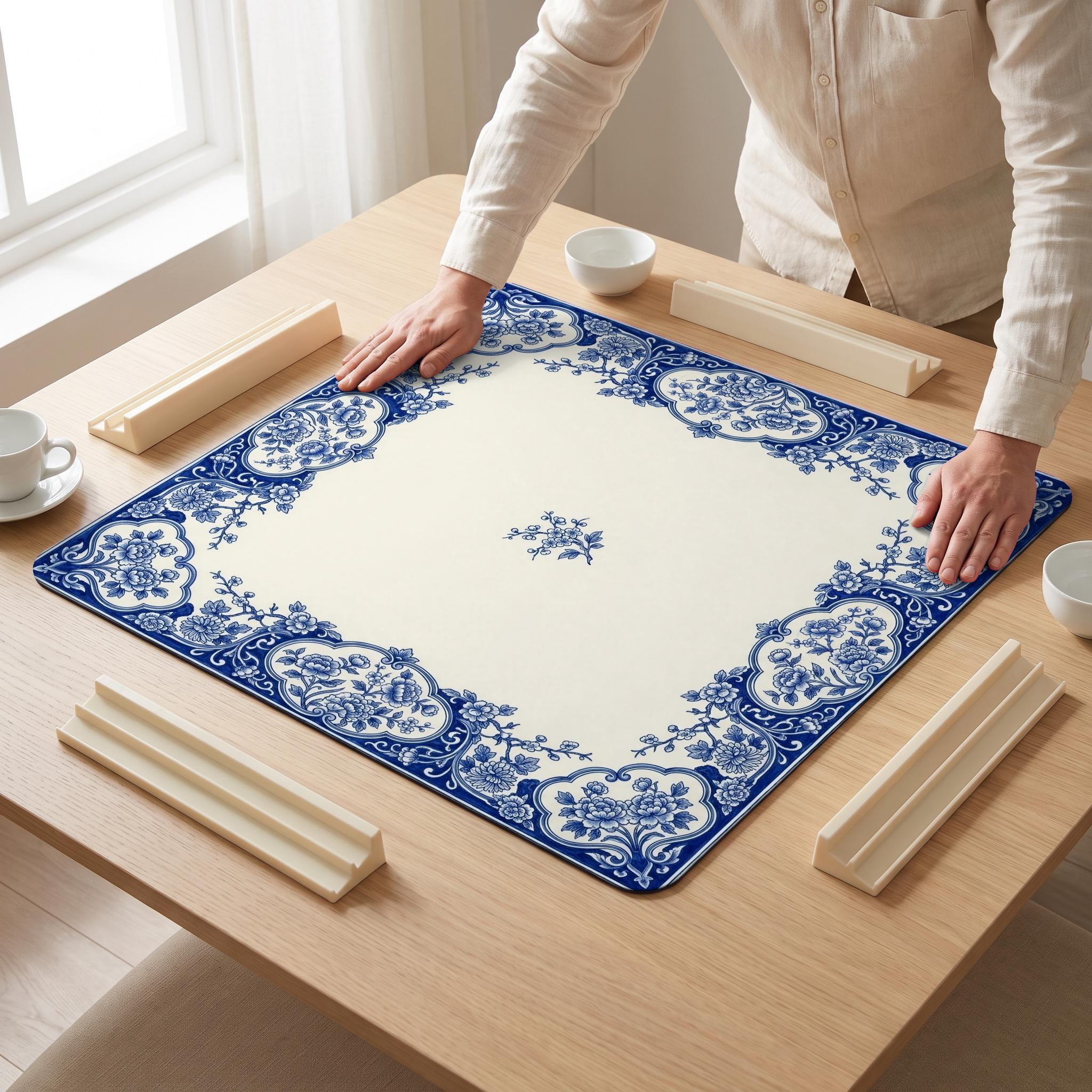 Delft Cartouche Mahjong Mat — hands unrolling